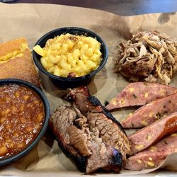 3 meat sampler with puller pork, sausage, and brisket with baked beans and mac and cheess