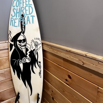 Perkatory coffee - a surfboard leaning against a wall - Coffee & Tea Near Me - Branford, Connecticut