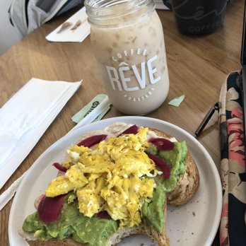 Reve Coffee Lab - Avocado toast (I already took a bite lol) and iced chai tea latte - Coffee & Tea Near Me - Baton Rouge, Louisiana Reve Coffee Lab - Avocado toast (I already took a bite lol) and iced chai tea latte - Coffee & Tea Near Me - Baton Rouge, Louisiana