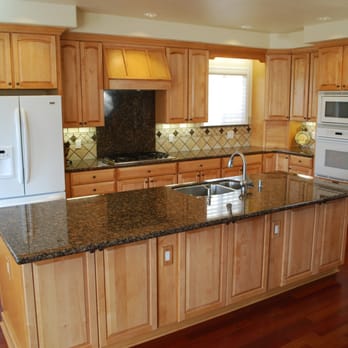 American Custom Contractors - a kitchen with granite counter tops - General Contractors Near Me American Custom Contractors - a kitchen with granite counter tops - General Contractors Near Me