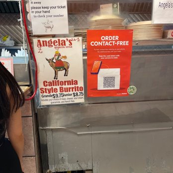 Angela's Burrito Style - a woman standing in front of a counter - Mexican Near Me - Chicago, Illinois