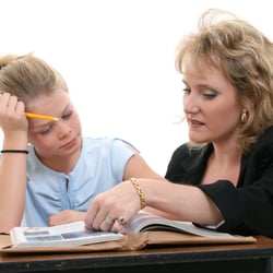 Aim High Tutors - Tutor helping student in home