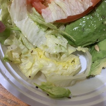 New Apolo - Avocado sald. Comes with lemon wedge only no dressing. - A salad featuring chopped lettuce, sliced tomato, and avocado in a white bowl, with a lemon wedge visible on the side. - Chinese Near Me - Brooklyn, New York