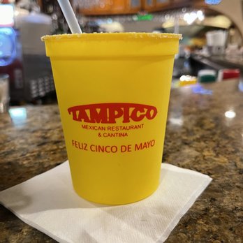 Tampico's - a yellow cup with a straw - Mexican Near Me - Lafayette, Louisiana
