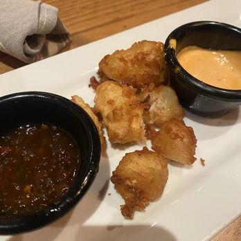 Thirsty Lion - SanTan Village - Cheese curds almost finished off, served with chipotle ranch and Jalepino jelly dip - American Near Me - Gilbert, Arizona Thirsty Lion - SanTan Village - Cheese curds almost finished off, served with chipotle ranch and Jalepino jelly dip - American Near Me - Gilbert, Arizona