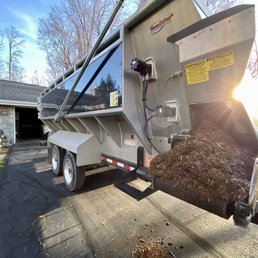 Truck hauler in our driveway with its cool chute to fill the wheelbarrows