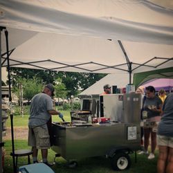 Wheat Street Dogs - Cooking up delicious vegan dogs at a farmers market at Firefly Farms!