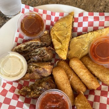 Aunt E’s Southern Cuisine - Sampler: cheese sticks, steak & cheese egg roll, jerk chicken egg roll, beef patty & plenty of dipping sauces - Chicken Wings Near Me - Greensboro, North Carolina Aunt E’s Southern Cuisine - Sampler: cheese sticks, steak & cheese egg roll, jerk chicken egg roll, beef patty & plenty of dipping sauces - Chicken Wings Near Me - Greensboro, North Carolina