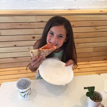 sLICe LIC - Birthday girl enjoying her slice @slice - Italian Near Me - Long Island City, New York sLICe LIC - Birthday girl enjoying her slice @slice - Italian Near Me - Long Island City, New York