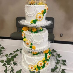 Nadines Bakery - Our wedding cake. Three layers of white cake, each layer filled with a different fruit filling: lemon, strawberry, and blueberry