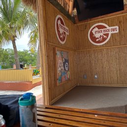 Performance stage with enclosed child play sandpit around the back just next to the waterway.
