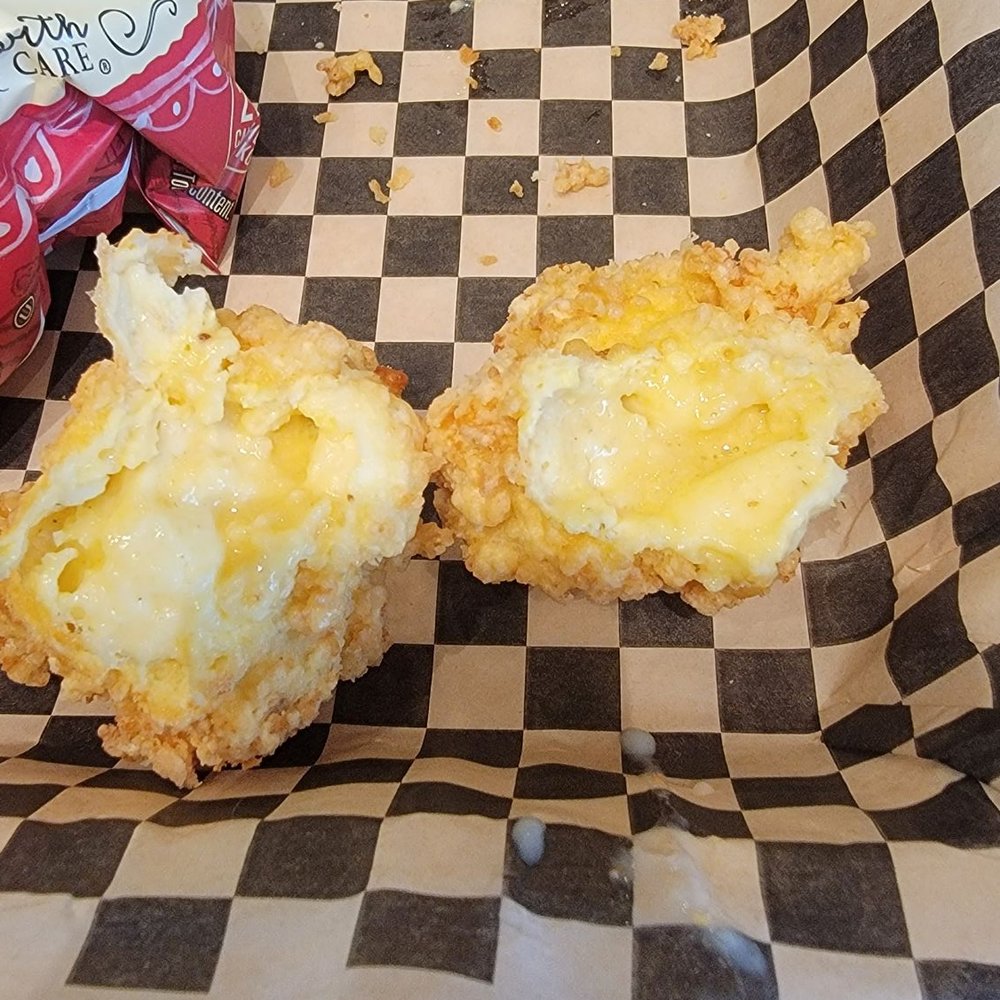 Horribly over-battered and undercooked cheese curds. Horribly over-battered and undercooked cheese curds.