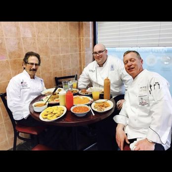 La Esquina Del Sabor - a group of chefs sitting around a table - Latin American Near Me - New Rochelle, New York La Esquina Del Sabor - a group of chefs sitting around a table - Latin American Near Me - New Rochelle, New York