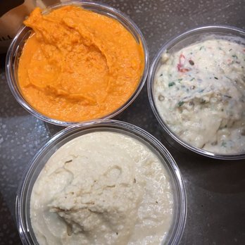 CAVA - Mezza dips w/roasted red hummus, red peppers and egg plant hummus, regular hummus - Mediterranean Near Me - Ashburn, Virginia