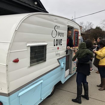 S'more Love Bakery - people getting food out of a trailer - Cupcakes Near Me S'more Love Bakery - people getting food out of a trailer - Cupcakes Near Me