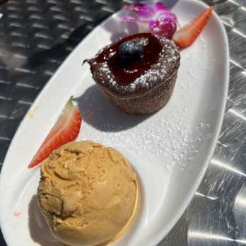 Puerto 27 Peruvian Kitchen & Pisco Bar - CHOCOLATE LAVA CAKE - $10 - warm molten chocolate, lucuma ice cream, fresh berries - Peruvian Near Me - Pacifica, California Puerto 27 Peruvian Kitchen & Pisco Bar - CHOCOLATE LAVA CAKE - $10 - warm molten chocolate, lucuma ice cream, fresh berries - Peruvian Near Me - Pacifica, California
