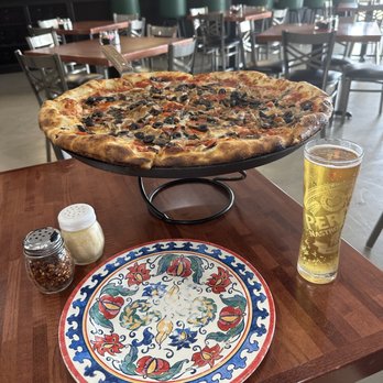 The Bing Pizzeria - That plate needs something, but I wanted to get the whole pie pic. - Pizza Near Me - League City, Texas
