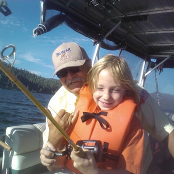 Cantrell Guide Service - John giving my son Gaven fishing tips.    John loves to photo bomb!  :) - Fishing Near Me - Big Bear Lake, California