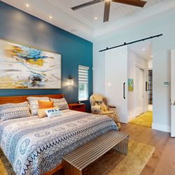 Master suite with 12 ft high barn door to master bath