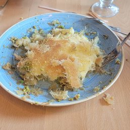 Dessert with pistachios, rose water and cheese. Dessert with pistachios, rose water and cheese.