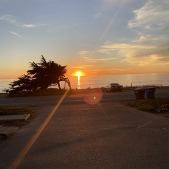 Fogcatcher Inn - View of sunset from bench by my room. - Hotels Near Me - Cambria, California Fogcatcher Inn - View of sunset from bench by my room. - Hotels Near Me - Cambria, California