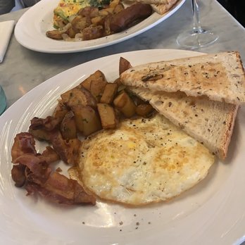Orange Blossom - two egg breakfast. eggs fried hard. breakfast potatoes were amazing! - Breakfast & Brunch Near Me - Miami Beach, Florida