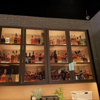 Eureka! Henderson - Liquor cabinet at the hostess stand - American Near Me - Henderson, Nevada