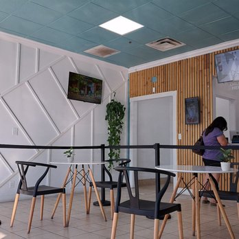 Kimochi Bubble Tea - a woman sitting at a table - Bubble Tea Near Me - Fort Lauderdale, Florida