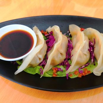 Nine Thai Kitchen - a plate of dumplings with sauce - Thai Near Me - Philadelphia, Pennsylvania Nine Thai Kitchen - a plate of dumplings with sauce - Thai Near Me - Philadelphia, Pennsylvania