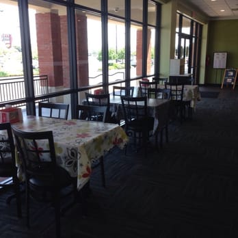 Chicken Salad Chick - Some tables up by the windows. - Salad Near Me - Montgomery, Alabama