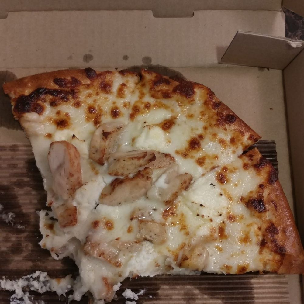 Popeye pizza with no spinach on it. Popeye pizza with no spinach on it.