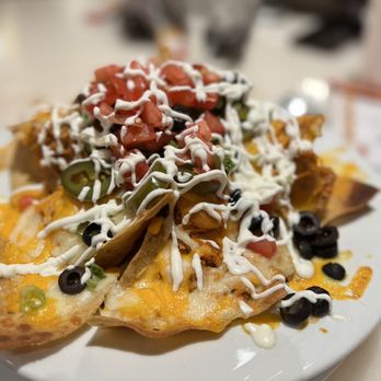 Café Milano - Macho Nachos w/ spicy shredded chicken - American Near Me - Reno, Nevada Café Milano - Macho Nachos w/ spicy shredded chicken - American Near Me - Reno, Nevada