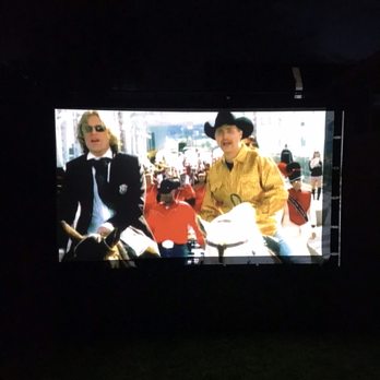 E&M Entertainment - Videos at night on a projector screen - DJs Near Me E&M Entertainment - Videos at night on a projector screen - DJs Near Me