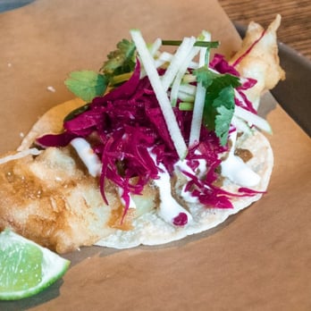 La Carnita - In Cod We Trust taco (cod, voltron sauce, lime crema, pickled red cabbage, green apple & cilantro) – $4.95 - Mexican Near Me - Toronto, Ontario La Carnita - In Cod We Trust taco (cod, voltron sauce, lime crema, pickled red cabbage, green apple & cilantro) – $4.95 - Mexican Near Me - Toronto, Ontario