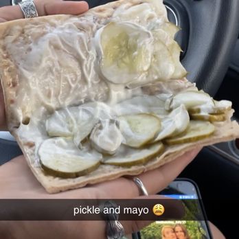 Subway - a person holding a piece of food in their hand - Sandwiches Near Me - Hartford, Michigan Subway - a person holding a piece of food in their hand - Sandwiches Near Me - Hartford, Michigan