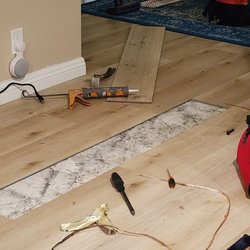 Affordable Floor Installation - Mor's team fixing the vinyl plank.