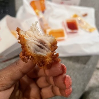 Chick-fil-A - ows a hand holding a piece of fried chicken - Fast Food Near Me - Houston, Texas Chick-fil-A - ows a hand holding a piece of fried chicken - Fast Food Near Me - Houston, Texas