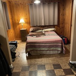 MacArthur House and Cabins - Bed alcove. Almost no furniture. Bed was brutal.