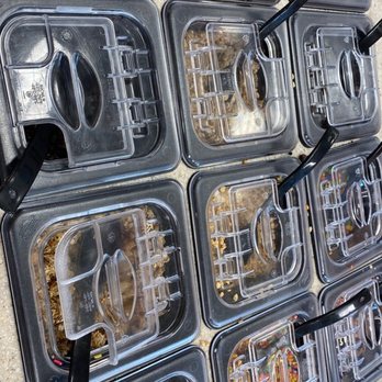 RaceTrac - a wall of food in plastic containers - Gas Stations Near Me - Cumming, Georgia