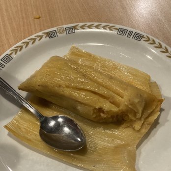Havana Sandwich Cafe - Delicious pork tamale with a bite taken - Cuban Near Me - Bloomfield, New Jersey