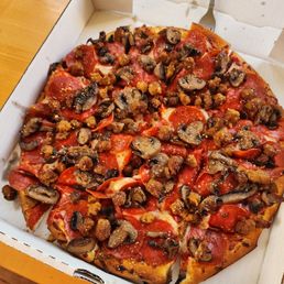 Pizza, pepperoni, sausage and mushrooms.