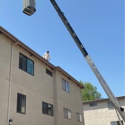 New AC getting craned onto the roof.