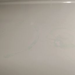 Greenish spots from dried detergent