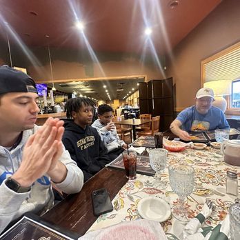 Cazadores Cantina - a group of people sitting at a table - Mexican Near Me - West Branch, Michigan