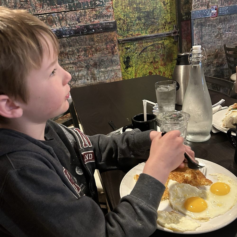 Side of eggs sunny side up and hashbrowns Side of eggs sunny side up and hashbrowns