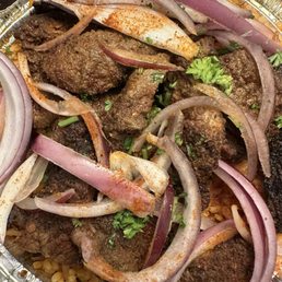 Jollof rice combo with beef suya Jollof rice combo with beef suya