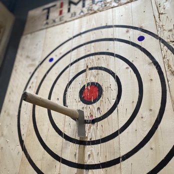 Timber Axe Bar & Bowl - a wooden target with a dart in it - Bars Near Me - Falmouth, Massachusetts Timber Axe Bar & Bowl - a wooden target with a dart in it - Bars Near Me - Falmouth, Massachusetts