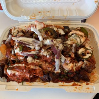 Indian King Biryani House - Chili chicken and chili lamb over rice. $8. - Food Trucks Near Me - New York, New York