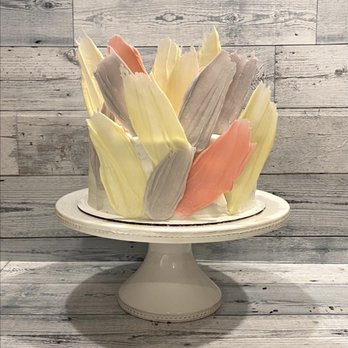 Mel's Scratch Bakery - a cake decorated with colorful icing - Desserts Near Me Mel's Scratch Bakery - a cake decorated with colorful icing - Desserts Near Me