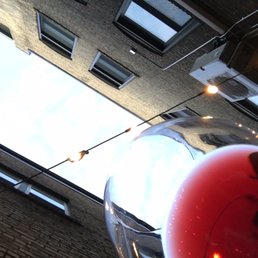 a glass of red wine in front of a building a glass of red wine in front of a building